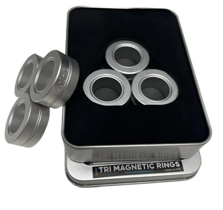 A trio of magnetic rings in a metal tin